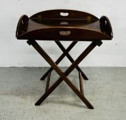 A MAHOGANY BUTLER'S TRAY WITH FOLDING SIDES ON FOLDING STAND TRAY 68 X 42CM.