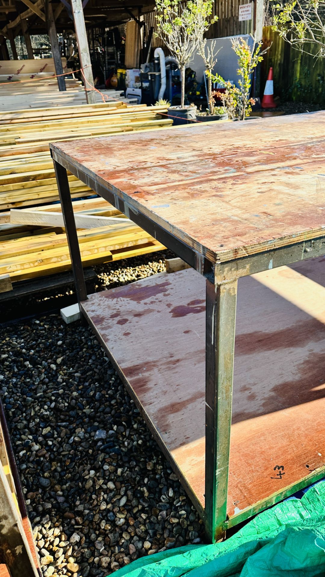 A HEAVY DUTY STEEL FRAMED WORK BENCH 122 X 244CM. THIS LOT IS SUBJECT TO VAT ON HAMMER PRICE. - Image 2 of 5