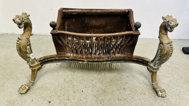 LARGE ANTIQUE CAST IRON FIRE BASKET, THE HEAVY BRASS FORELEGS DETAILED WITH MYTHICAL CREATURES,