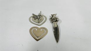 A GROUP OF THREE SILVER BOOKMARKS TO INCLUDE A FAIRY AND CAT EXAMPLES.