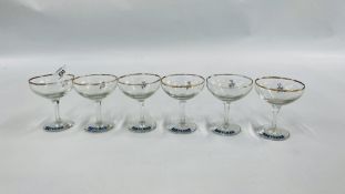 A SET OF SIX VINTAGE BABYCHAM GLASSES HAVING THE WHITE BAMBI STICKER.