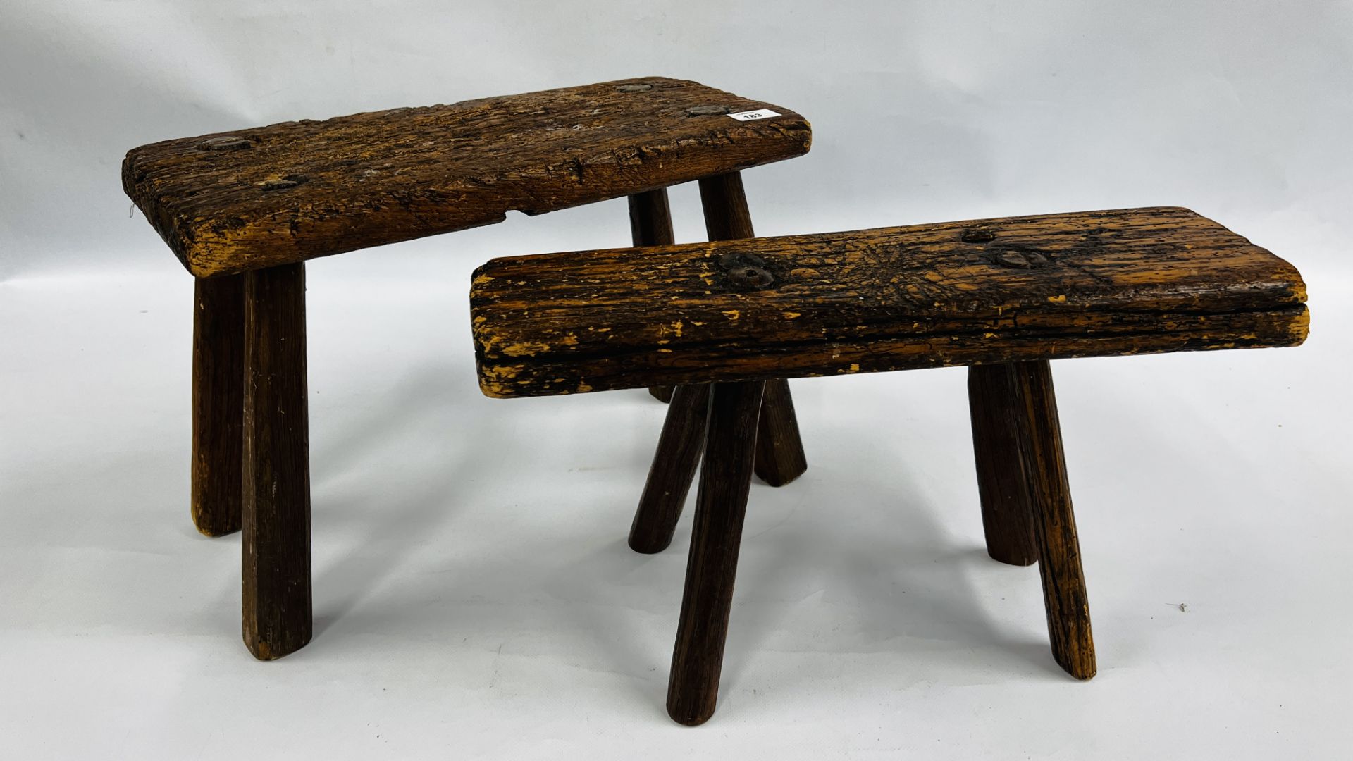 TWO VINTAGE HANDCRAFTED HARDWOOD LOW/MILKING STOOLS (SIGNS OF PREVIOUS WOODWORM).