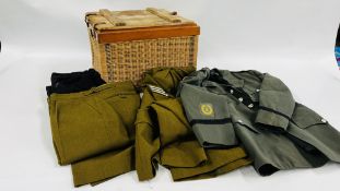 A COLLECTION OF MILITARY UNIFORMS IN A WICKER M.O.D. BOX.