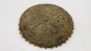 ANTIQUE POSSIBLY OTTOMAN LEATHERED SHIELD WITH METAL STUDDED DETAIL, DIAMETER 46CM.