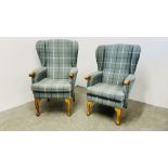 A HIS & HERS SET OF MODERN BLUE CHECKERED UPHOLSTERED BEECH WOOD WING BACK CHAIRS.