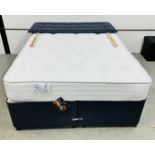 A DOUBLE DIVAN BED WITH STORAGE BASE,