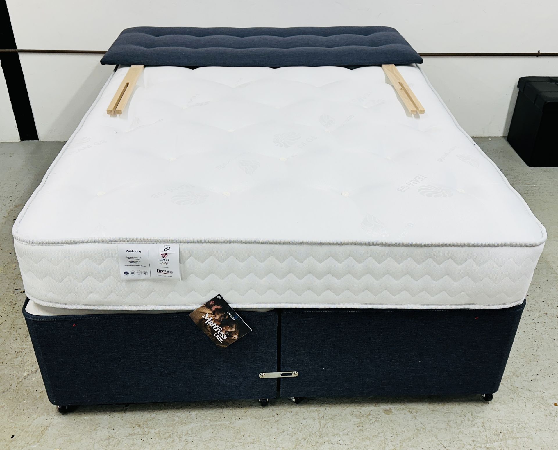 A DOUBLE DIVAN BED WITH STORAGE BASE,