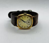 A VINTAGE 9CT GOLD CASED WRIST WATCH MARKED HERBERT ....... LTD MAGNO LUX ON A BROWN LEATHER STRAP.