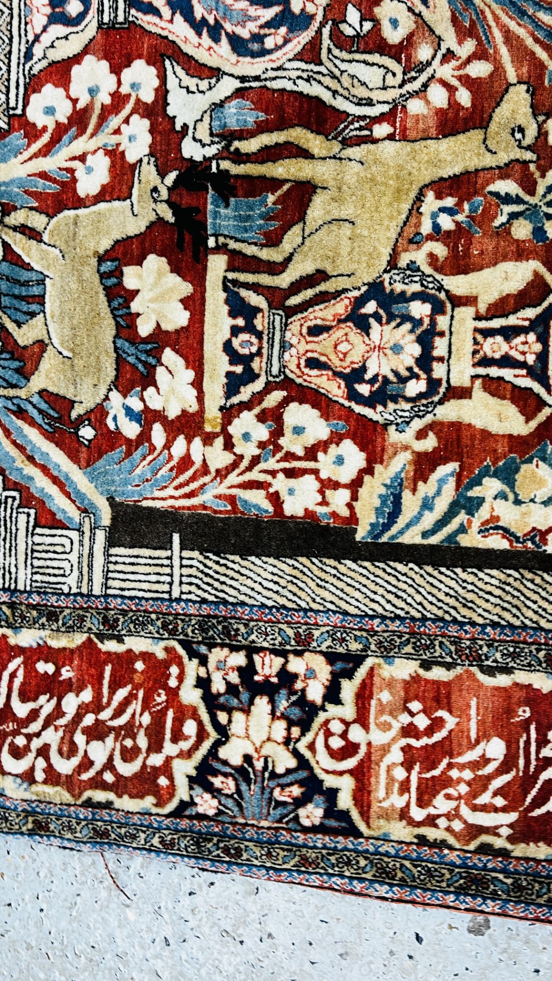 A PERSIAN DESIGN RUG DECORATED WITH SPRAYS OF FLOWERS AND DEER AND ARABIC INSCRIPTIONS, - Image 23 of 32