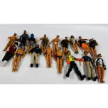 A BOX CONTAINING A GROUP OF 16 ASSORTED ACTION MAN FIGURES IN VARIOUS OUTFITS.