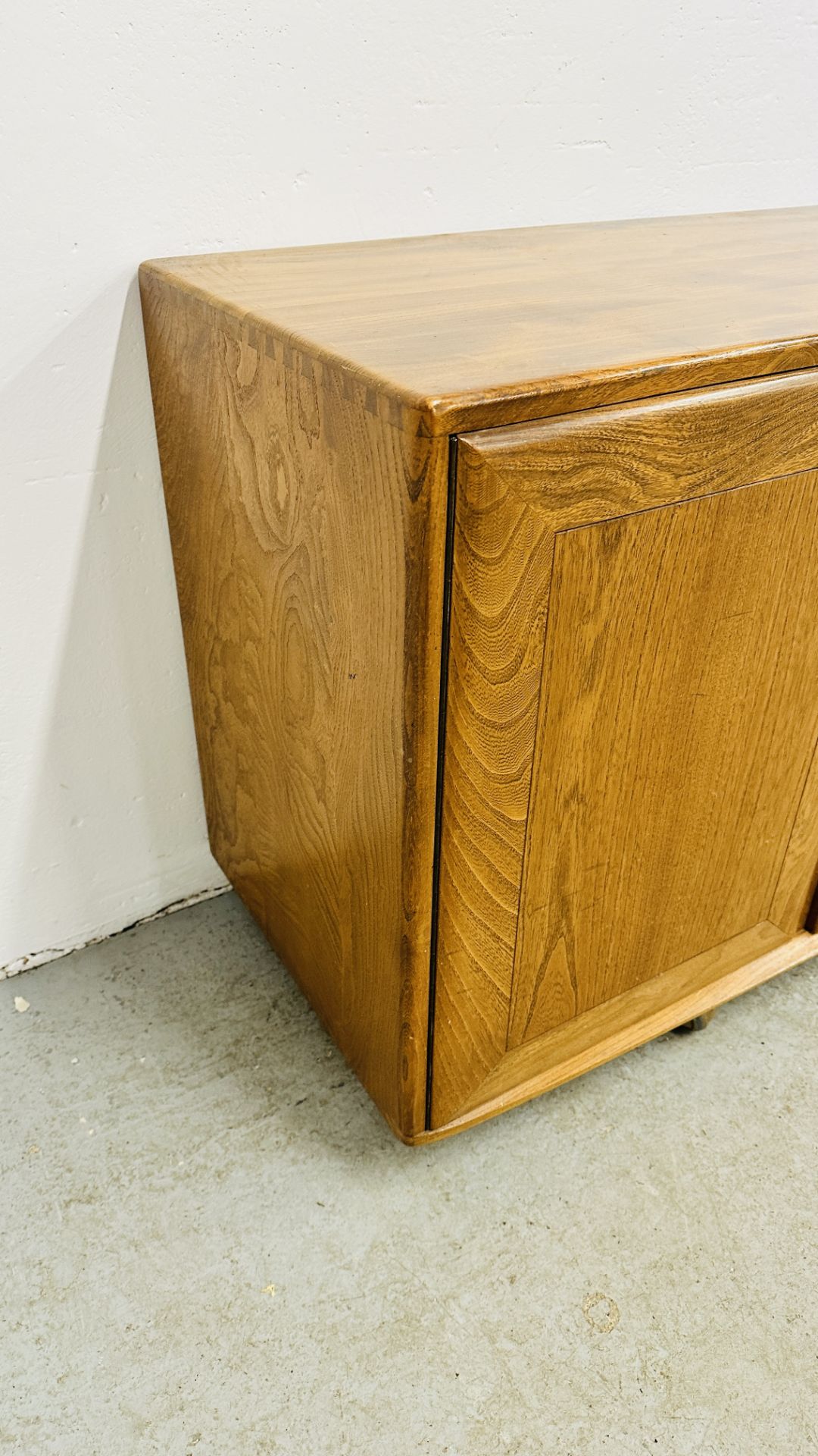 ERCOL WINDSOR 3 DRAWER 2 DOOR SIDEBOARD ON CASTERS - W 155CM X D 44CM X H 69CM. - Image 9 of 13