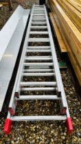 A HEAVY DUTY ALUMINIUM 13 RUNG TRIPLE EXTENSION LADDER. THIS LOT IS SUBJECT TO VAT ON HAMMER PRICE.