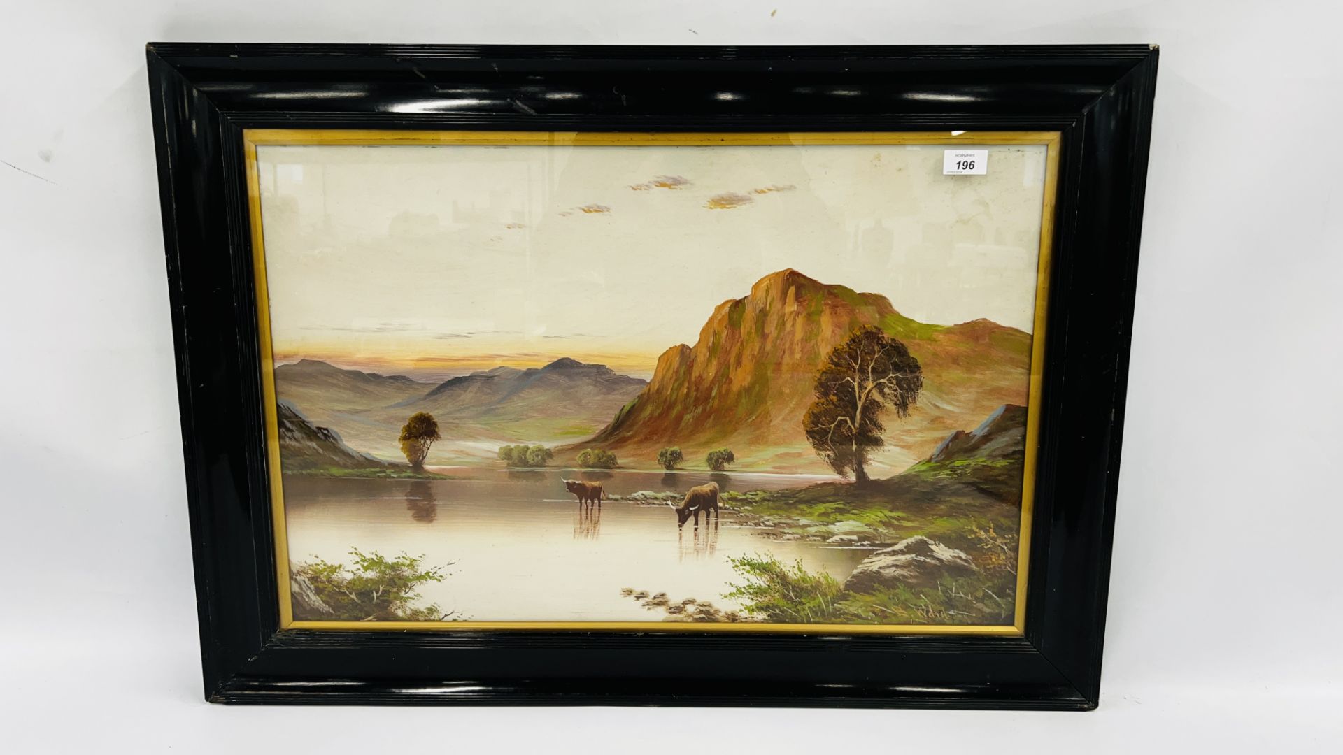 A FRAMED AND MOUNTED OIL ON BOARD DEPICTING HIGHLAND CATTLE IN THE MOUNTAINS BEARING SIGNATURE B.