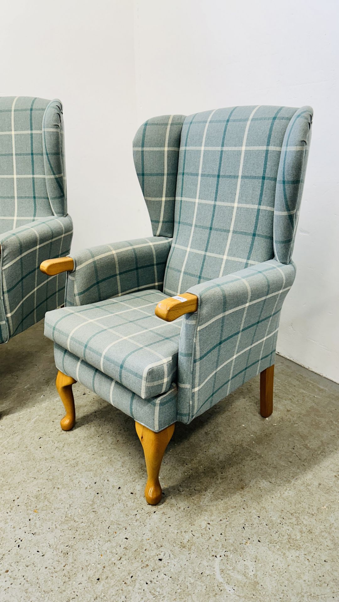 A HIS & HERS SET OF MODERN BLUE CHECKERED UPHOLSTERED BEECH WOOD WING BACK CHAIRS. - Image 3 of 17