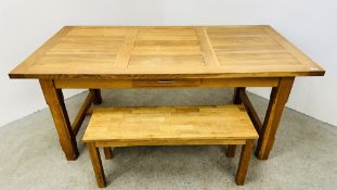 A SOLID OAK DINING TABLE WITH SINGLE DRAWER 180CM X 90CM ALONG WITH A JULIEN BOWEN BENCH SEAT 100CM.