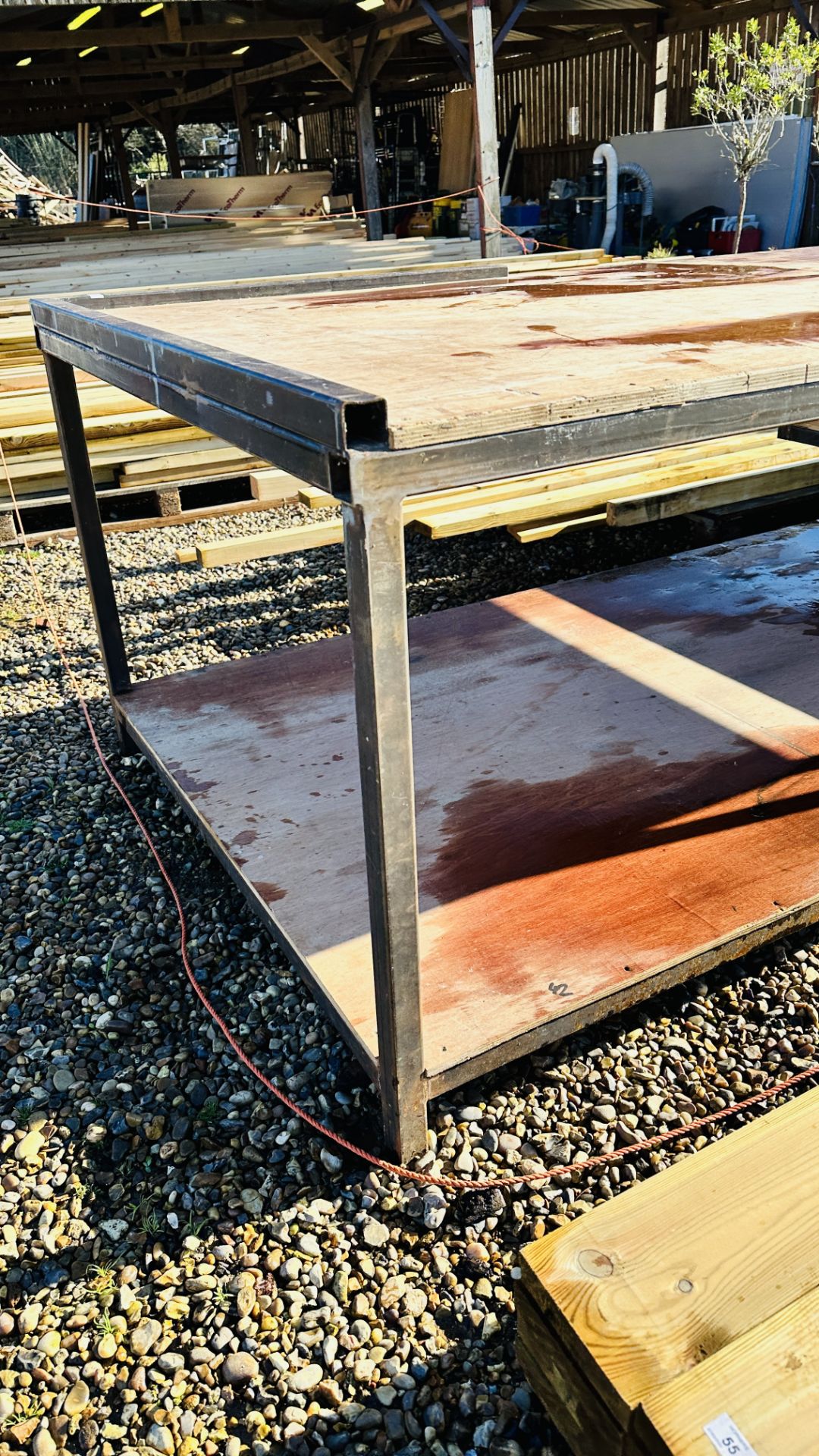 A HEAVY DUTY STEEL FRAMED WORK BENCH 122 X 244CM. THIS LOT IS SUBJECT TO VAT ON HAMMER PRICE. - Image 2 of 4