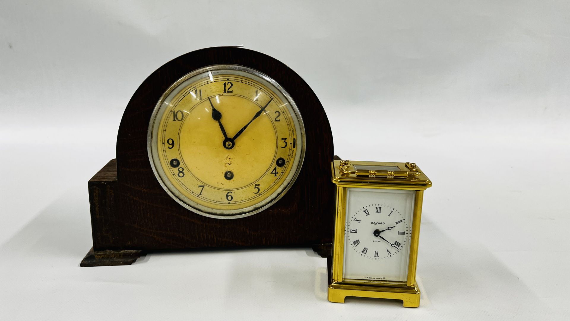 A GARROD 8 DAY MANTEL CLOCK ALONG WITH AN 8 DAY CARRIAGE CLOCK.