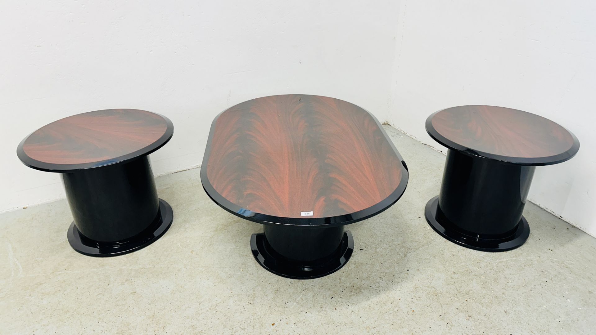3 MATCHING DESIGN HIGH GLOSS MAHOGANY FINISH COFFEE TABLES INCLUDING A PAIR OF CIRCULAR AND 1 OVAL.