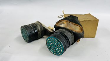TWO VINTAGE WW2 GAS MASKS ONE EXAMPLE RETAINS ITS ORIGINAL BOX - COLLECTORS ITEMS ONLY.