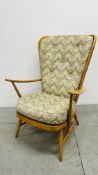 AN ERCOL WINDSOR TALL BACK EASY CHAIR.