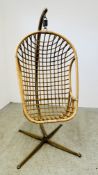 A VINTAGE RATTAN HANGING EGG CHAIR.