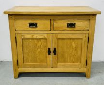 A MODERN LIGHT OAK TWO DRAWER OVER TWO DOOR SIDEBOARD W 100CM X D 42CM X H 83CM.