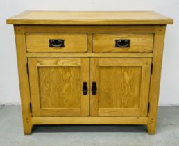 A MODERN LIGHT OAK TWO DRAWER OVER TWO DOOR SIDEBOARD W 100CM X D 42CM X H 83CM.