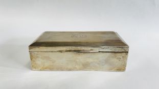 A VINTAGE SILVER CIGARETTE BOX BIRMINGHAM ASSAY J.H.W (RUBBED MARKS) BEARING MONOGRAM MJ 24.7.