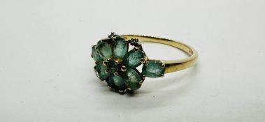 A 9CT GOLD CLUSTER RING SET WITH TURQUOISE STONES.