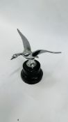 A CHROME "FLYING SWAN" CAR MASCOT, NOW MOUNTED ON PLASTIC STAND - HEIGHT MASCOT 9.5CM.