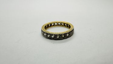 AN ETERNITY RING SET WITH CLEAR STONES MARKED 18CT PLAT. SIZE N/O.