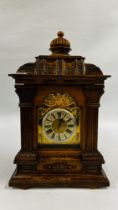 ANTIQUE OAK MANTEL CLOCK WITH CARVED DETAIL AND COLUMN SUPPORTS,