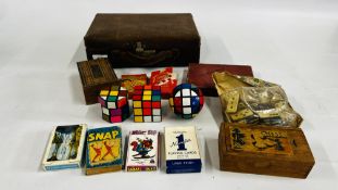 A VINTAGE SUITCASE AND CONTENTS TO INCLUDE VINTAGE GAMES,