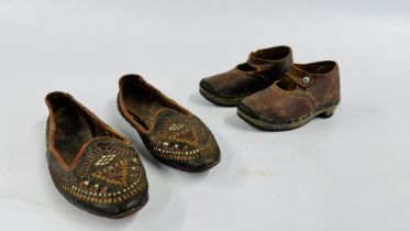 A PAIR OF VINTAGE CHILD'S CLOGS ALONG WITH A FURTHER PAIR OF LEATHER SHOES.