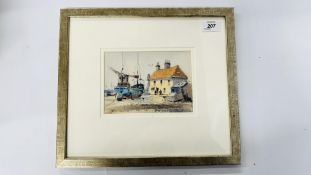 A FRAMED AND MOUNTED WATERCOLOUR DEPICTING A COASTAL SCENE BEARING SIGNATURE PETER GILMAN - W 17.