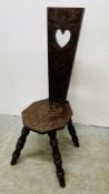 A VINTAGE MAHOGANY CARVED SPINNING CHAIR.