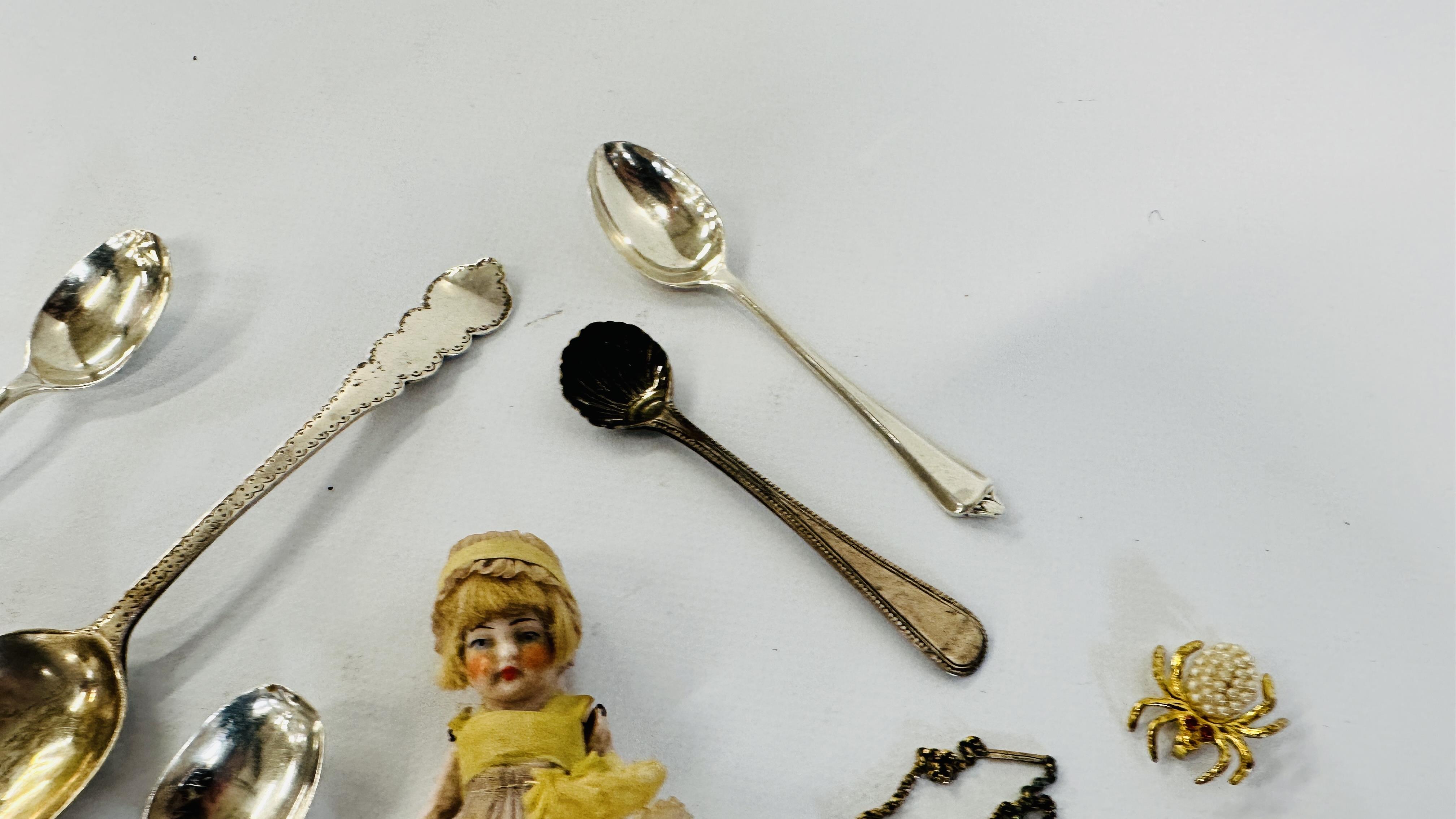A GROUP OF 8 ASSORTED SILVER SPOONS, GILT SPIDER BROOCH ETC. AND A VINTAGE BISQUE MINIATURE DOLL. - Image 7 of 8