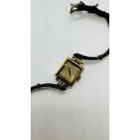 A VINTAGE 9CT GOLD CASED LADIES WRIST WATCH MARKED "AVIA".