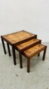 A NEST OF 3 VINTAGE TILE TOP TABLES.