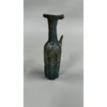 A VINTAGE ROMAN STYLE BOTTLE MOULDED FROM PALE BLUE TRANSLUCENT GLASS A/F H 13CM.