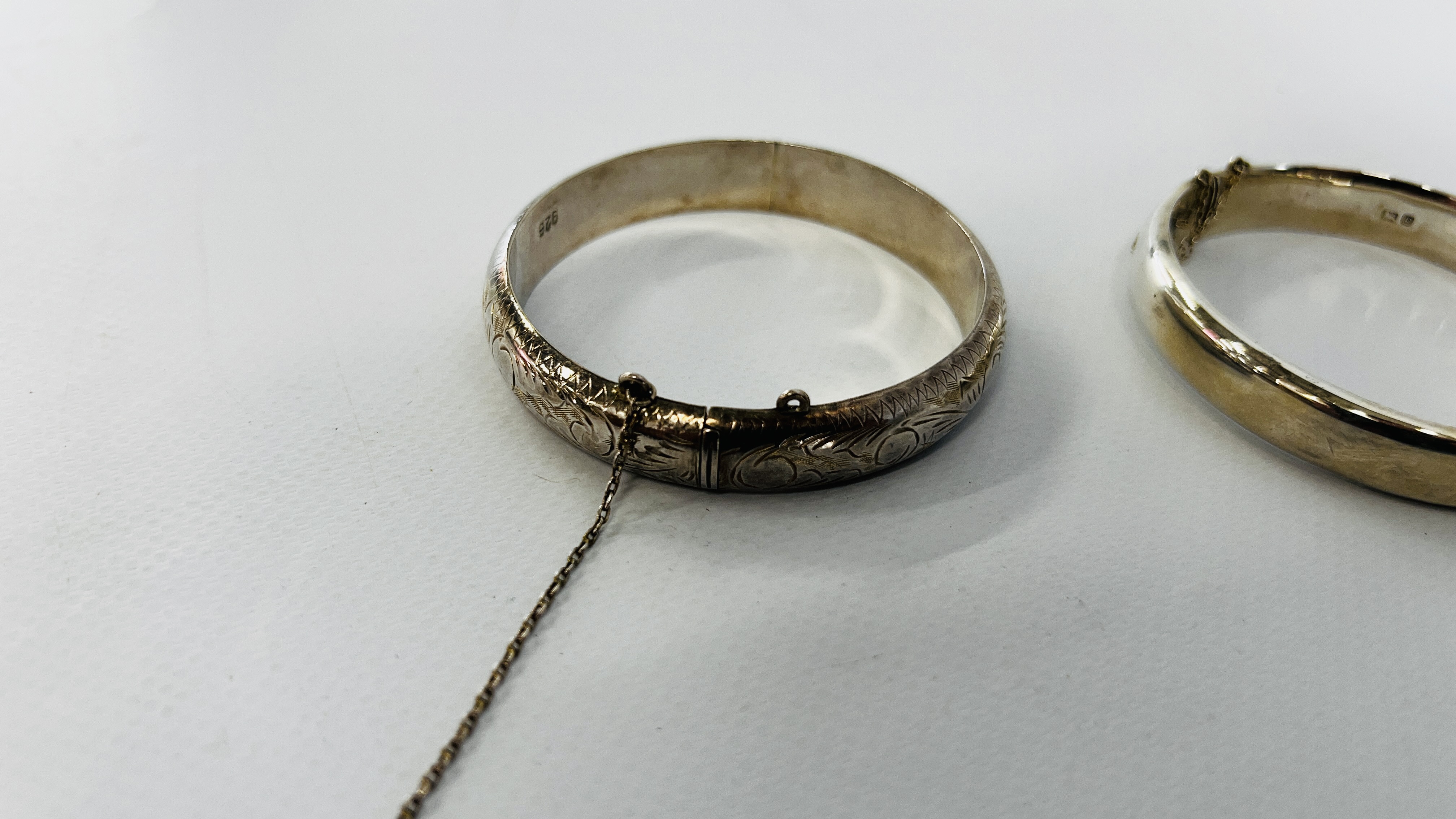 TWO SILVER ENGRAVED HINGED BANGLES BOTH HAVING SAFETY CHAINS. - Image 4 of 11