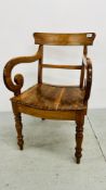 A VINTAGE MAHOGANY ELBOW CHAIR WITH SWEEPING ARMS.