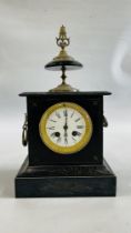 A VINTAGE SLATE MANTEL CLOCK WITH ENAMEL DIAL, TWO ELABORATE BRASS HANDLES AND A DECORATIVE FINIAL.