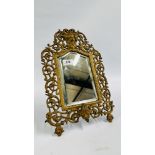 A GILT FINISHED BRASS BEVEL PLATE ELABORATE MIRROR WITH GOD FIGURE - H 38CM X W 25.5CM.