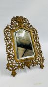 A GILT FINISHED BRASS BEVEL PLATE ELABORATE MIRROR WITH GOD FIGURE - H 38CM X W 25.5CM.