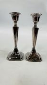 PAIR SILVER CANDLESTICKS CHESTER ASSAY, THE COLUMNS OF SQUARE FLUTED FORM, FILLED, HEIGHT 17.5CM.