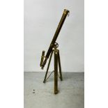A REPRODUCTION LACQUERED BRASS TELESCOPE FITTED ON A TRIPOD BASE.