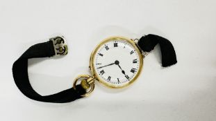 A LADIES 9CT GOLD CASED FOB WATCH WITH LATEST MODIFIED LOOPS FOR STRAP MARKED ALDRED & SON GREAT