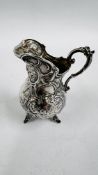 A CONTINENTAL SILVER CHERUB DECORATED JUG H 9CM.