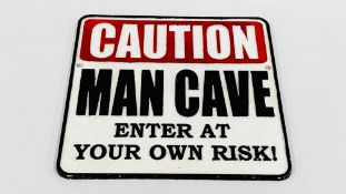 (R) CAUTION MAN CAVE SIGN.